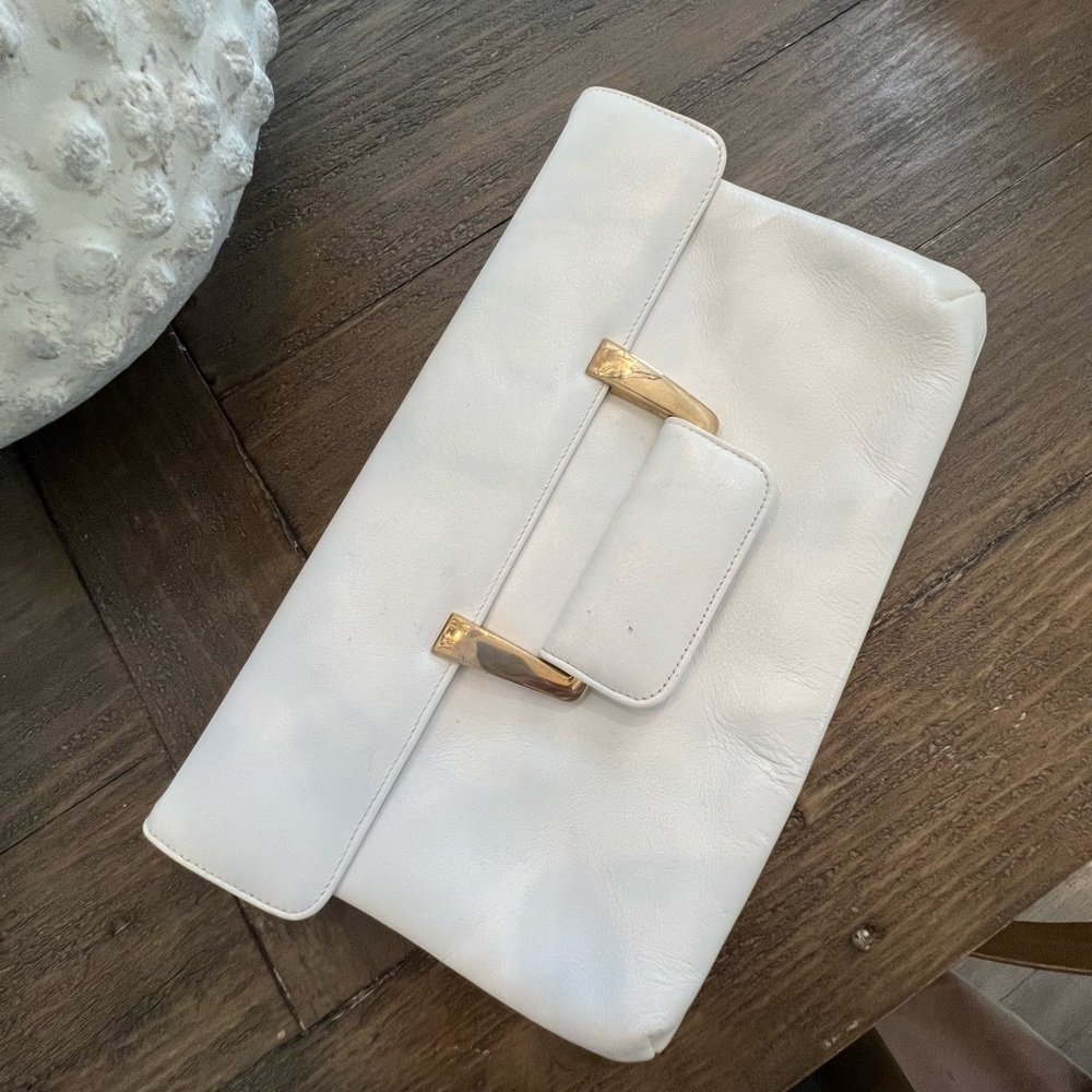 White clutch with gold closure